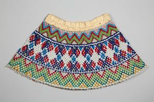 Image: beaded collar, central band of white, red and blue, edged with green & others